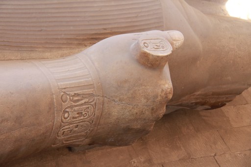 Holding his cartouche