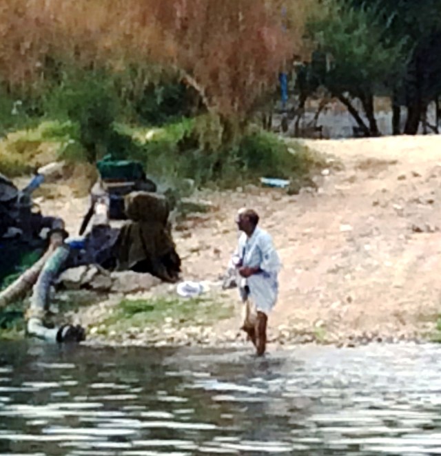 Man taking his daily bath in the Nile near Luxor